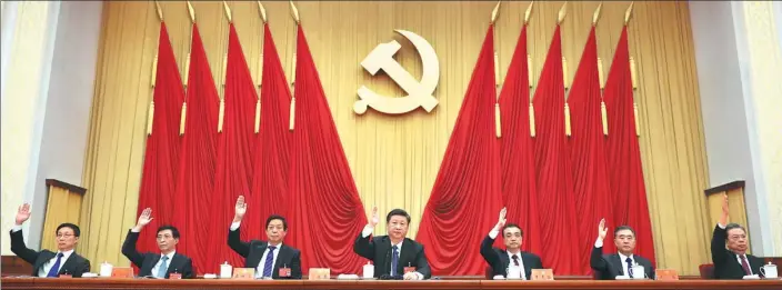  ?? PHOTOS BY JU PENG / XINHUA ?? The Standing Committee of the Political Bureau of the CPC Central Committee takes a vote during the Third Plenary Session of the 19th CPC Central Committee, which was held in Beijing from Monday to Wednesday.