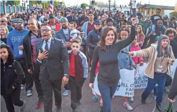  ?? TOM TINGLE/THE REPUBLIC ?? Hundreds march on Washington Street in downtown Phoenix on Monday as they make their way to Margaret T. Hance Park where the festivitie­s continued.