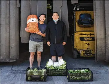  ?? CALLA KESSLER / THE WASHINGTON POST ?? Joseph Boo helped his father, Kian Tai Boo, make the fast move to online sales for the family company, Fresh Goods. Kian Tai Boo has sold vegetables in New York City for more than 28 years.