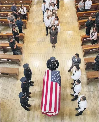  ?? Brian van der Brug Los Angeles Times ?? THE COFFIN holding the body of Officer Juan Jose Diaz, killed July 27, is covered with an American flag.