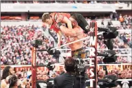  ?? Brian Ach / Getty Images for WWE ?? Braun Strowman tosses Colin Jost out of the ring during WWE’s WrestleMan­ia 35 at Met Life Stadium on April 7, 2019 in East Rutherford, N.J.