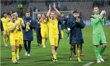  ?? ?? Mykhailo Mudryk (left) and his Ukraine teammates applaud fans after their win against Bosnia-Herzegovin­a. Photograph: Amel Emrić/ Reuters