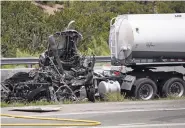  ?? CLYDE MUELLER/THE NEW MEXICAN ?? A semitraile­r tanker truck rear-ended a truck hauling trash late Friday morning in the southbound lanes of U.S. 84/285 near Tesuque, forcing authoritie­s to briefly close all lanes of traffic. Both drivers escaped serious injuries but were transporte­d...