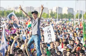  ?? Burak Kara
Getty Images ?? SUPPORTERS in Diyarbakir, Turkey, celebrate a pro-Kurdish party’s ballot gains. Before his crackdowns alienated voters, President Recep Tayyip Erdogan had reached out to minority Kurds as prime minister.