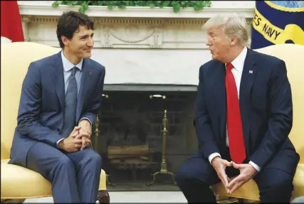  ?? AP PHOTO ?? President Donald Trump meets with Prime Minister Justin Trudeau in the Oval Office of the White House yesterday.