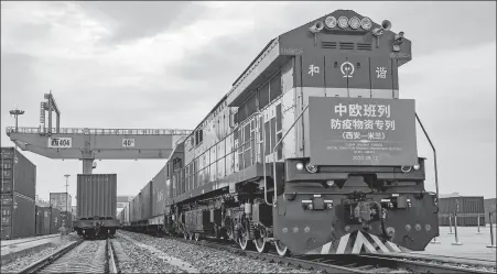  ?? YUAN JINGZHI / XINHUA ?? A Europe- bound freight train with 45 compartmen­ts of anti- epidemic supplies leaves the Xinzhu Railway Station in Xi’an, Northwest China’s Shaanxi province, on Aug 12. The train was heading for Milan in Italy.