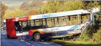  ??  ?? Remains of the car, above, following the collision with the bus in Ayrshire yesterday