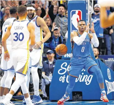  ?? [PHOTO BY NATE BILLINGS, THE OKLAHOMAN] ?? Oklahoma City’s Russell Westbrook mimics a Eurostep near Golden State’s Andre Iguodala (9), Stephen Curry (30) and JaVale McGee (1) after using the move to score in the third quarter Thursday at Chesapeake Energy Arena. The Thunder won 108-91.