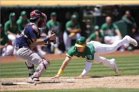  ?? JEFF CHIU — THE ASSOCIATED PRESS ?? Boston Red Sox catcher Connor Wong, left, prepares to tag out Oakland’s JJ Bleday at home during the fifth inning of Wednesday’s game in Oakland. The Red Sox lost to the lowly A’s.