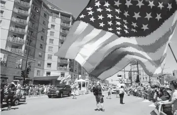  ?? CHRIS SWEDA Chicago Tribune ?? Flags and floats were in abundance along the route of the 2022 Chicago Pride Parade on Sunday afternoon.