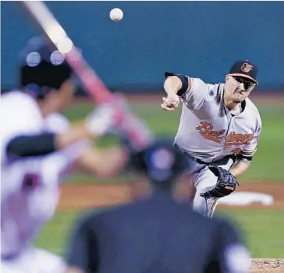  ?? CHARLES KRUPA/ASSOCIATED PRESS ?? Kevin Gausman, delivering a first-inning pitch, allowed four singles and a walk in eight innings before giving way to All-Star closer Zach Britton for the ninth inning. Gausman has a 0.82 ERA over his past five starts, and the Orioles finished their...