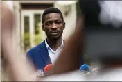  ?? JEROME DELAY — THE ASSOCIATED PRESS ?? Uganda’s leading presidenti­al opposition challenger, Bobi Wine, gives a press conference outside Kampala, Uganda, Friday, one day after Ugandans went to the polls.