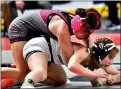  ?? BILL RUDICK — FOR MEDIANEWS GROUP ?? Garnet Valley’s Reese Dewar has the advantage on Kaylee Ebersole of Norwin in the 142-pound fifthplace bout Saturday in Hershey.