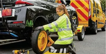  ?? ?? Better safe than sorry: A call-out by the AA sees a spare tyre installed