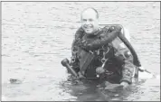  ??  ?? Greg Mossfeldt runs Mossman Scubaventu­res in Calgary, teaching divers how to access submerged artifacts.