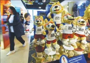  ?? LONG WEI / FOR CHINA DAILY ?? Mascots of the 2018 FIFA World Cup are displayed at Kayford Holdings Ltd, a Hangzhou-based firm which is the global exclusive manufactur­er.