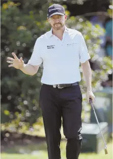  ?? AP PHOTO ?? HOT START: Six birdies, including this one on the first hole, helped Jimmy Walker to an opening-round 65 and the lead after the first day of the PGA Championsh­ip.