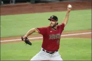  ?? JEFFREY MCWHORTER - THE ASSOCIATED PRESS ?? Arizona Diamondbac­ks pitcher Madison Bumgarner throws against the Texas Rangers during the first inning of a baseball game in Arlington, Texas, in this Wednesday, July 29, 2020, file photo.