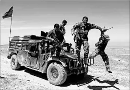  ?? RAHMAT GUL/AP ?? Afghan commandos arrive Friday at Pandola village near the site of where the U.S. used its largest non-nuclear bomb against ISIS in Nangarhar province, east of the capital of Kabul.