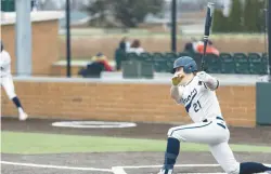  ?? VINCENT D. JOHNSON/DAILY SOUTHTOWN ?? Lemont’s Brandon Johnson (21) follows through on his swing as he puts the ball in play against Evergreen Park.