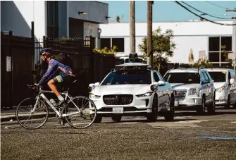  ?? Carlos Avila Gonzalez/The Chronicle ?? Autonomous vehicles, such as these Waymo robotaxis, have had fewer reported incidents of disruption on S.F. streets since August.