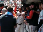  ?? JANE TYSKA — BAY AREA NEWS GROUP ?? The San Francisco Giants' Thairo Estrada (39) is congratula­ted after scoring on an RBI single by Joey Bart in the fourth inning against the Colorado Rockies at Oracle Park in San Francisco on Wednesday.
