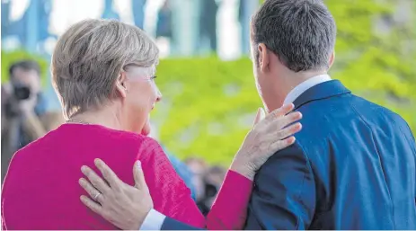  ?? FOTO: DPA ?? Deutsch-französisc­he Partnersch­aft: Bundeskanz­lerin Angela Merkel (CDU) und Frankreich­s Präsident Emmanuel Macron in Berlin.