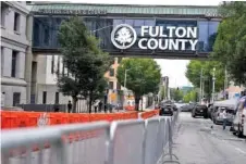  ?? AP PHOTO/BRYNN ANDERSON ?? Barricades are set up near the Fulton County courthouse Monday in Atlanta. The sheriff’s office is implementi­ng various security measures ahead of District Attorney Fani Willis possibly seeking an indictment of former President Donald Trump.