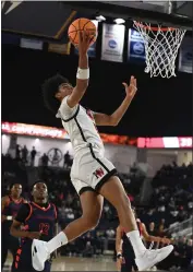  ?? PHOTOS BY MILKA SOKO ?? Harvard-Westlake's Robert Hinton goes for a layup in the CIF-SS Open Division title game. Hinton had 15 points.