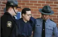  ?? THE ASSOCIATED PRESS ?? Eric Frein is led away by Pennsylvan­ia State Police Troopers at the Pike County Courthouse after his preliminar­y hearing Jan. 5, 2015, in Milford, Pa.