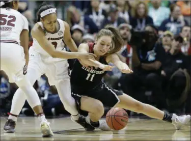  ?? TONY GUTIERREZ — THE ASSOCIATED PRESS ?? South Carolina guard Allisha Gray (10) and Stanford forward Alanna Smith (11) scramble for the ball during the first half.