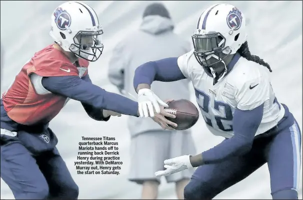  ??  ?? Tennessee Titans quarterbac­k Marcus Mariota hands off to running back Derrick Henry during practice yesterday. With DeMarco Murray out, Henry gets the start on Saturday.