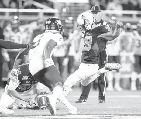  ??  ?? OSU kicker Matt Amendola kicks a first-half field goal during the Cowboys win over Virginia Tech on Thursday in Orlando, Florida. COURTESY OSU ATHLETICS] [PHOTO BY BRUCE WATERFIELD,