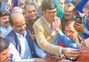  ?? PRABHAKAR SHARMA /HT ?? BJP state chief Ashok Parnami & panchayati raj minister Rajendra Rathore celebrate at party office in Jaipur.