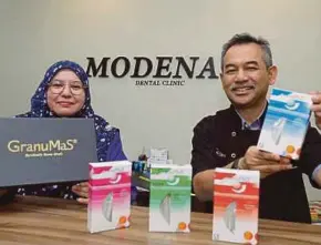  ?? PIC BY NURUL SYAZANA ROSE RAZMAN ?? Granulab (M) Sdn Bhd chief executive officer Dr Fazilah Fazan and Dr Firdaus Hanapiah from Modena Dental Clinic with the GranuMaS product.