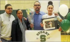  ?? GREGG SLABODA — TRENTONIAN PHOTO ?? Stuart’s Jalynn Spaulding, right, scored her 1,000th point on Wednesday. With her are her brother Jared, her mom Michelle and dad David.