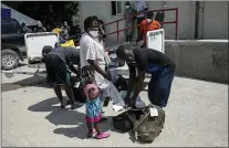  ?? RODRIGO ABD — THE ASSOCIATED PRESS ?? Haitian migrants deported from the US gather after their arrival to the Toussaint Louverture Internatio­nal Airport in Port-au-Prince, Haiti, Sunday, Sept. 19, 2021.