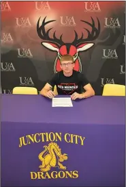  ?? Contribute­d Photo ?? Hodge signs: Junction City's Keelan Hodge finishes signing with Arkansas Rich Mountain on Thursday.