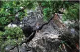  ??  ?? A member of Climb Yangon on a route during their rock climbing training at Bayin Nyi cave at Hpa-an, Karen state.