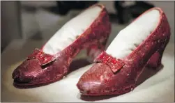  ?? ED ZURGA/The Associated Press ?? These ruby slippers were worn by Judy Garland in The Wizard of Oz (1939).