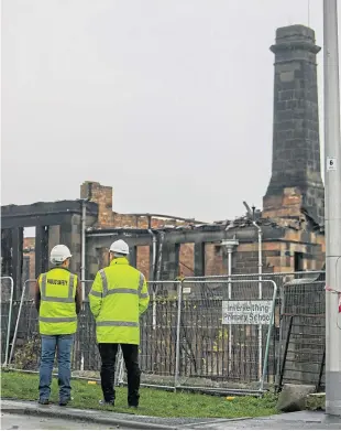 ?? Picture: Steven Brown. ?? The burned-out shell of Inverkeith­ing Primary where walls on the first floor were said to pose a significan­t risk of collapse.