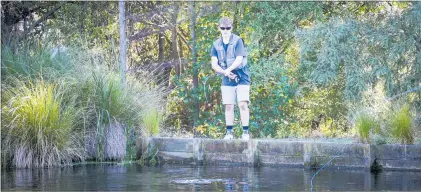  ?? PHOTOS / PAUL TAYLOR ?? Denny Trow trying his luck in the game farm’s pond.