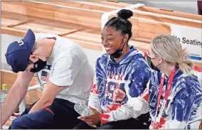  ?? Robert Deutsch-USA TODAY Sports ?? Simone Biles watches the men’s individual all-around final during the Tokyo 2020 Olympic Summer Games at Ariake Gymnastics Centre on Wednesday in Tokyo.