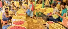  ?? — P. SURENDRA ?? Flower merchants in Gudi Malkapur market eagerly wait for Navratri and Bathkamma festivals as their business has been affected due to rains.