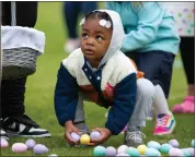  ?? GRACE RAMEY — DAILY NEWS VIA AP FILE ?? A youngster collects Easter eggs during an egg hunt at Easterfest at the Bowling Green Ballpark in Bowling Green, Ky., April 8, 2023. In 2024, for the second year in a row consumers have faced sticker shock ahead of Easter and Passover, events in which eggs play prominent roles.