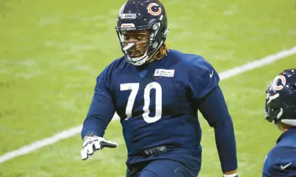  ?? JOSE M. OSORIO/ ?? Bears tackle Braxton Jones stretches at rookie minicamp May 6 at Halas Hall in Lake Forest.