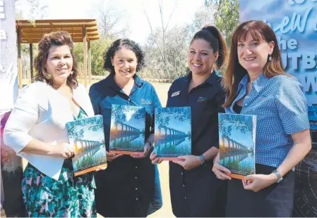  ?? Picture: Contribute­d ?? TOURIST SEASON LAUNCH: Showing off the new travel guide are (from left) Mayor Samantha O'Toole with Sandra Lee, Kyra Passman and Kim Wildman.