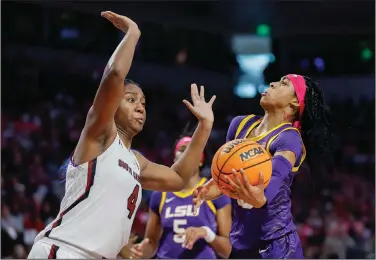  ?? Associated Press ?? Road blocked: LSU guard Alexis Morris, right, drives to the basket against South Carolina forward Aliyah Boston during the second half of an NCAA college basketball game in Columbia, S.C., Sunday.