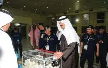  ??  ?? This photo released by the Interior Ministry shows Deputy Prime Minister and Interior Minister Sheikh Mohammad Al-Khaled AlHamad Al-Sabah touring a polling station yesterday.