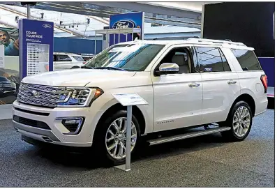  ?? AP Ford Motor Co. said Tuesday that it will shift 550 jobs to its Kentucky Truck Plant to increase production of its Expedition, like the one above, and Lincoln Navigator to meet growing demand. ??